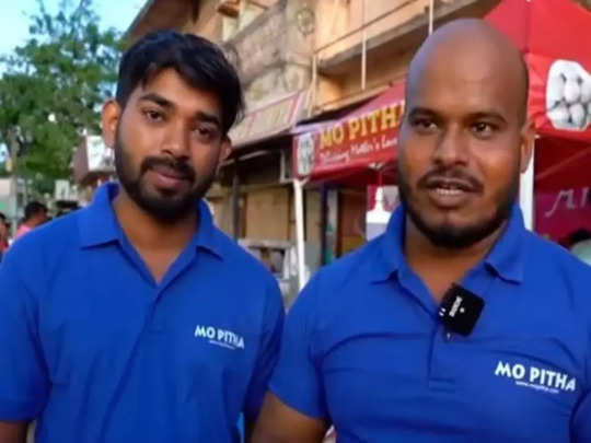 two men in blue polo shirts